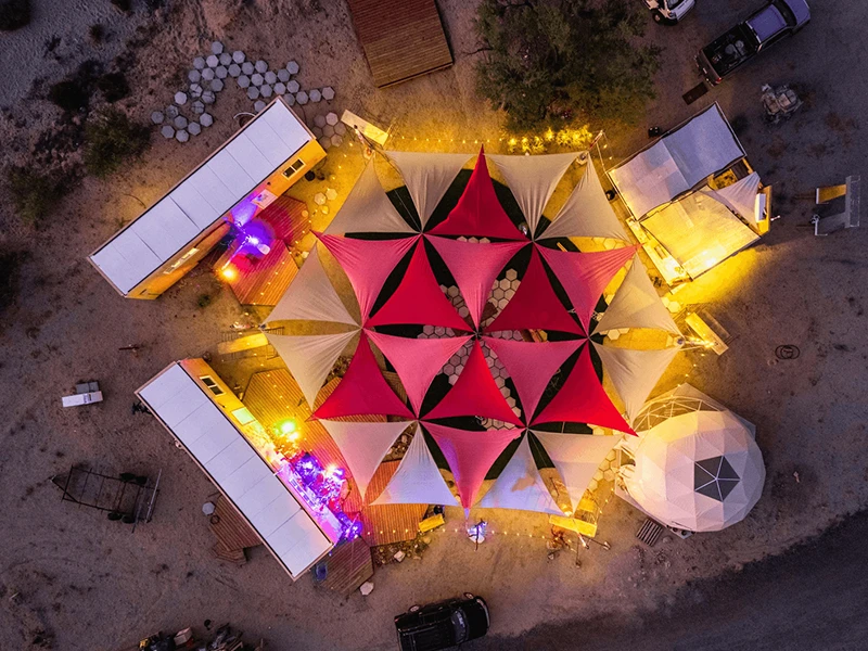 Nighttime aerial view area light up - Nomadic Communal Space Nighttime aerial view area light up - Nomadic Communal Space